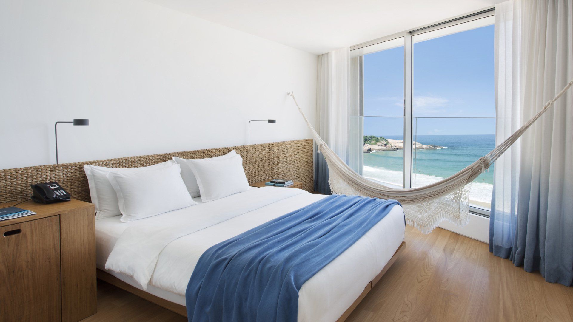Guest room at Hotel Arpoador with ocean view and hammock